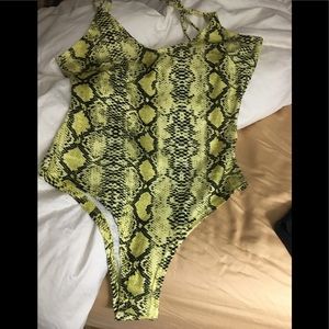 Never worn yellow and black body suit